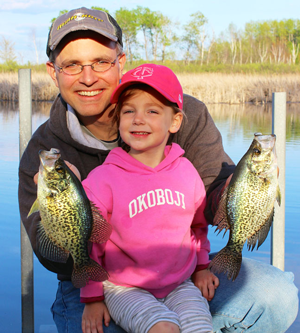 image of Jason Halfen and youn angler with nice crappies