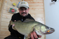 image of Jason Feldner holding Devils Lake Walleye