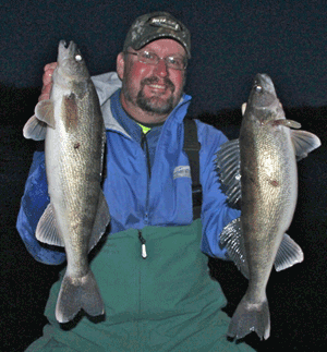 image of fisherman with 2 Walleyes