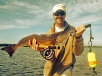 image of Bill McLaughlin with first redfish