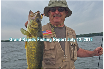 image shows location of walleyes of angler holding big walleye caught trolling spinners on Grand Rapids are lake