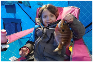 image of kid with big sunfish