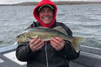 image of angler on Winnie with nice walleye