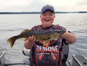 image of boy with nice walleye