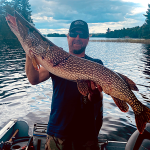 image of angler with giant pike