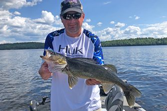 image of Joe Berguist with Namakan Walleye