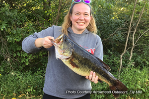 image of woman holding big largemouth bass