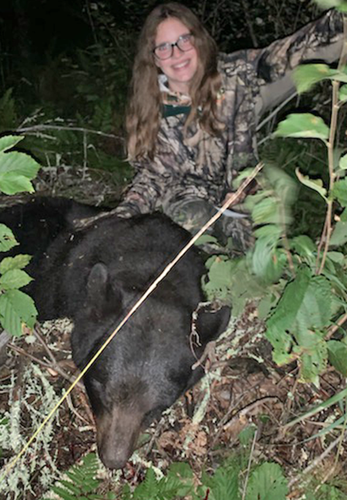 image of Natalie with 300 pound bear she bagged near Kabetogama