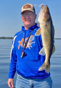 image of angler holding nice walleye links to kabetogama fishing report