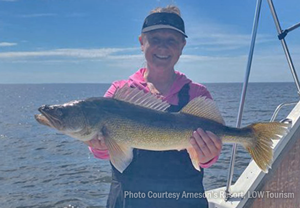 image of woman with big walleye caught on LAke of the Woods