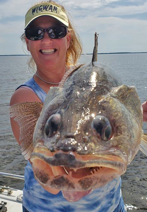 image of woman with huge Lake of the Woods Walleye