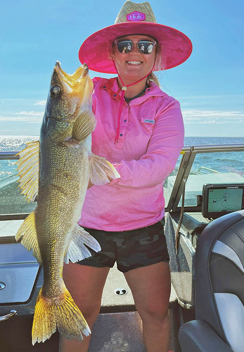 image of woman with monster walleye caught on Lake of the Woods