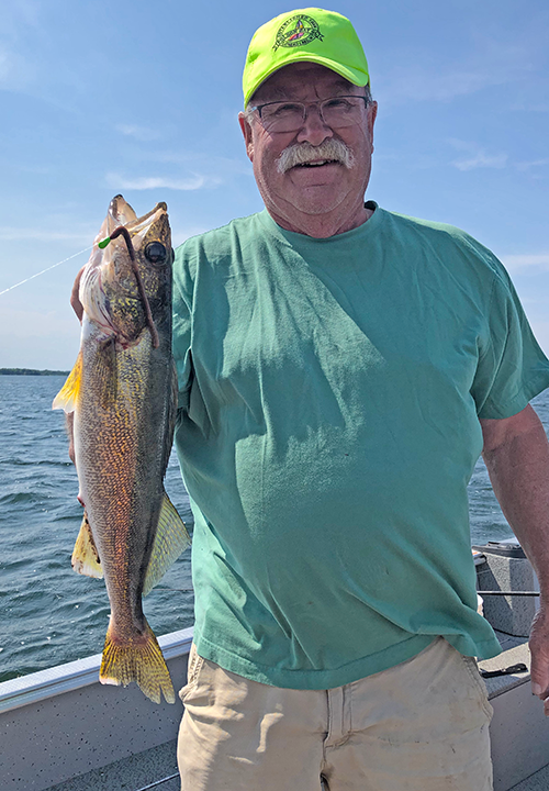 image of Mike Cooley with nice walleye caught  on a wiggle worm