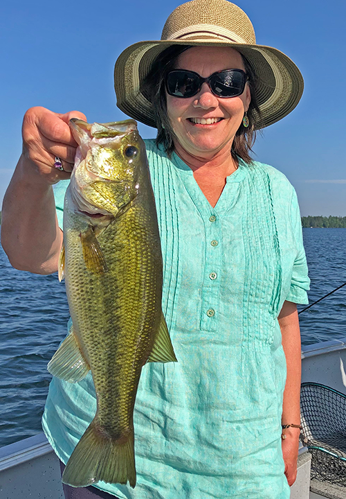 image of the Hippie Chick with a nice Largemouth Bass