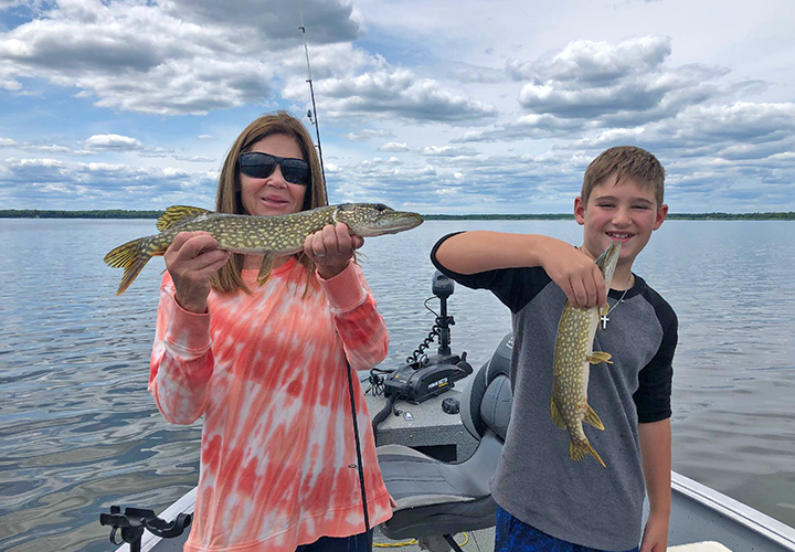 Image of Pat Stuhlman and grandson Noah with a pair of pike caught trolling