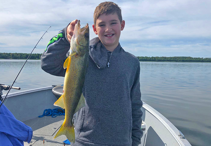 image of noah with nice walleye caught by Noah trolling Little Joe spinnerss