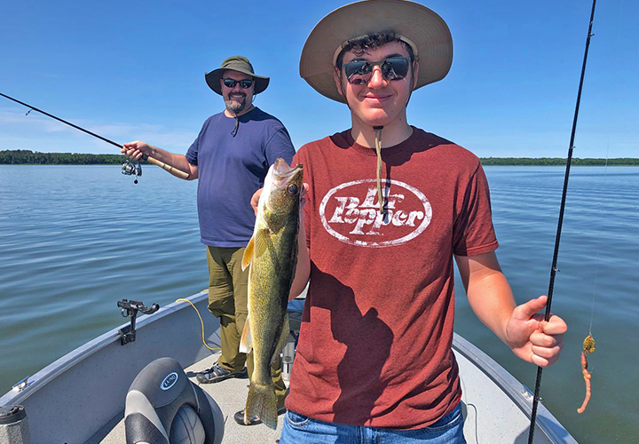 image of Adam Kleymann with nice walleye