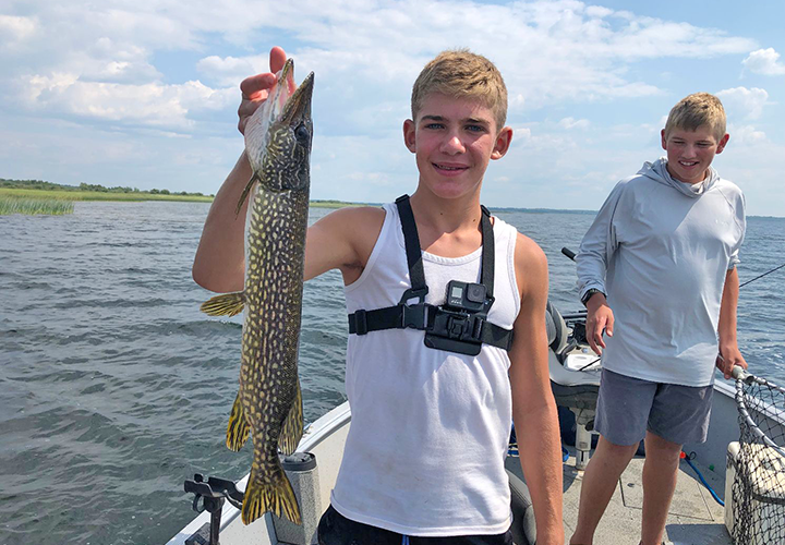 image of Owen Cheatham with nice northern pike
