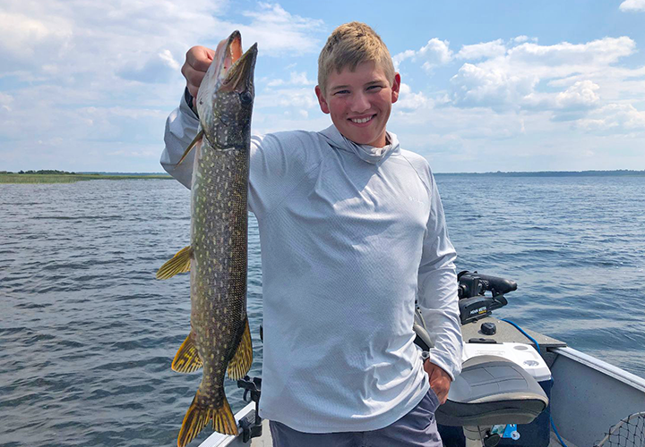 image of Camp Hastings crew member Josie holding nice pike