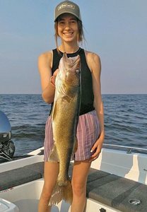 image of woman holding huge walleye caught on Lake of the Woods