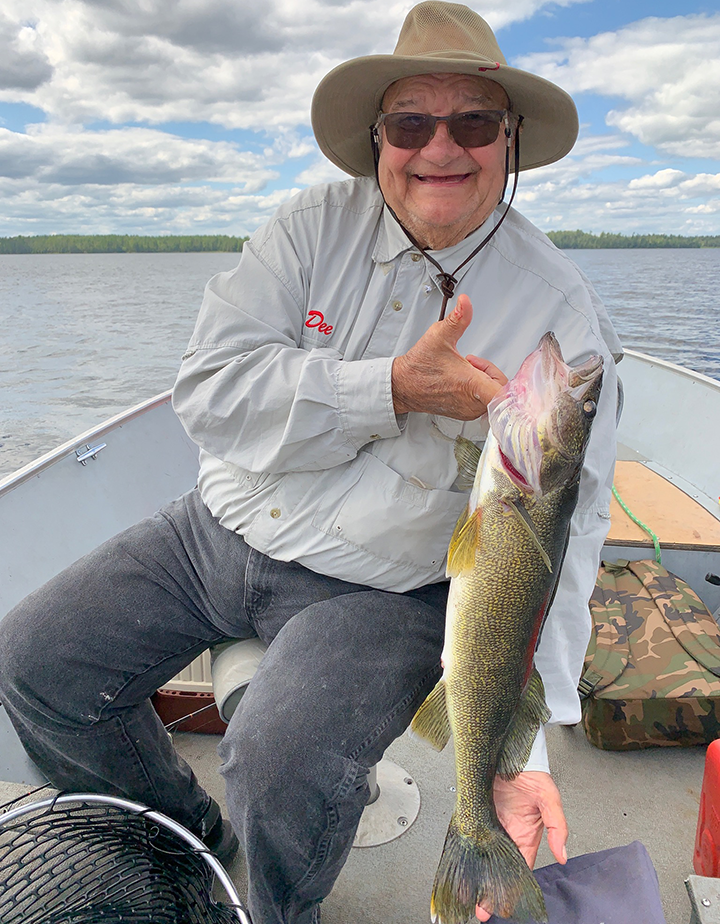 image of angler with big walleye caught in the ely mn area