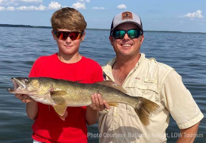 image of young angler with nice walleye caught on lake of the woods while at Ballard's Resort