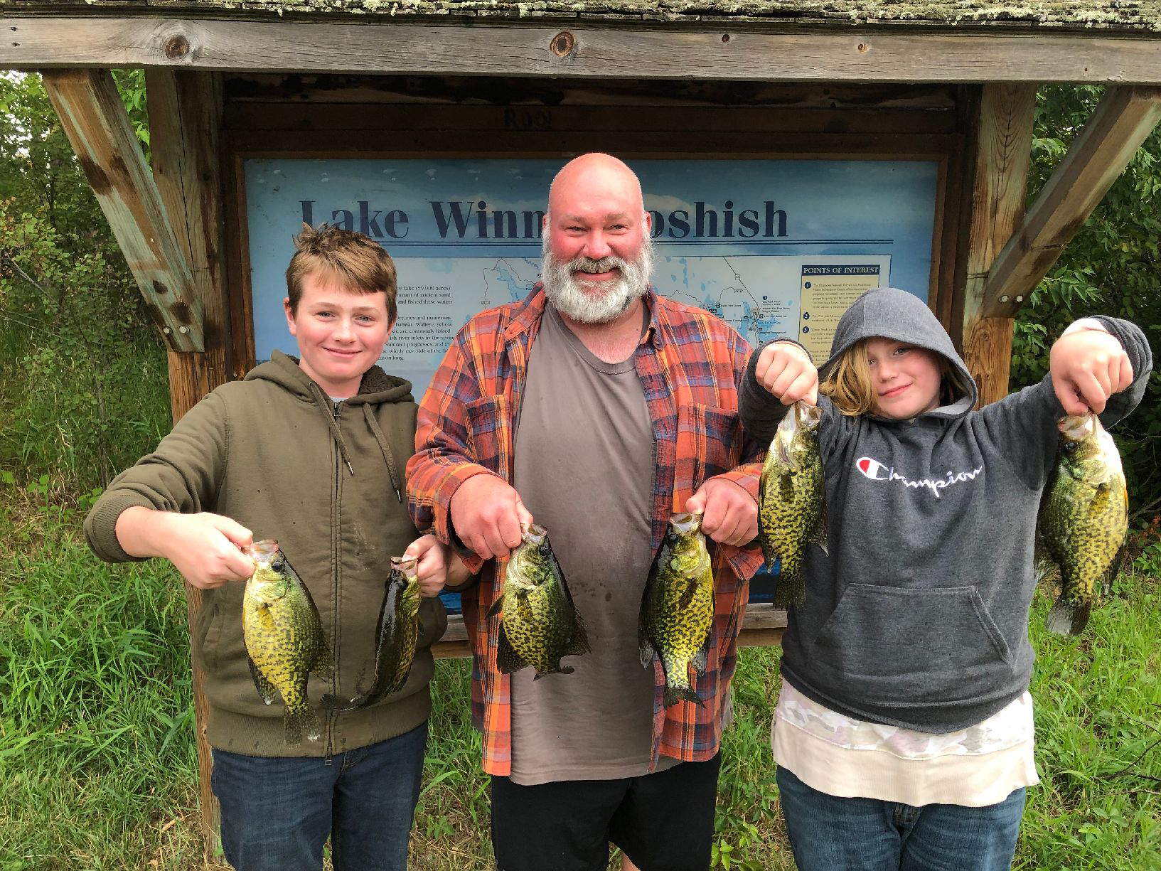 image of Raymond, Logan and Josephine Shouse holding nice crappies from Lake Winnie