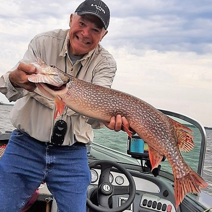 image of Jim Henry holding nice northern pike caught on lake of the woods