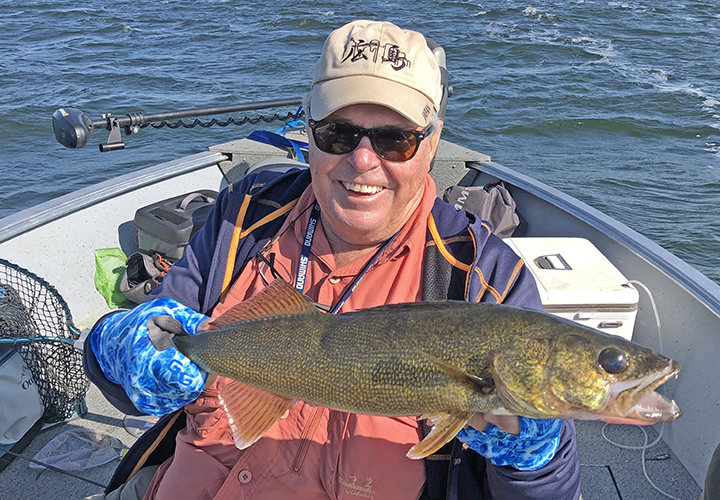 image of Dick Williams with big walleye c aught on Lake Winnibigoshish