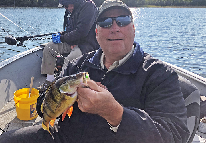image of Paul Kautza with huge perch caught on a jig and minnow