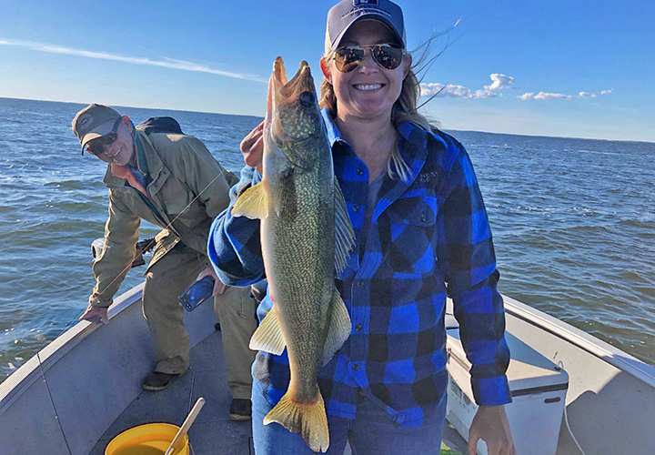 image of Kim Milius with fat winnie walleye