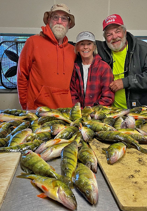 image of Greg, along with Keith and Diane Eberhardt and their catch of jumbo perch