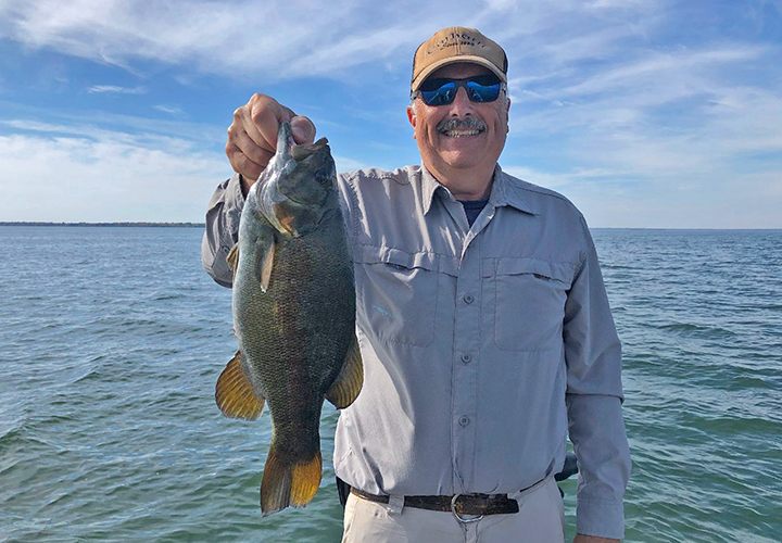 image of Tom with nice smallmouth bass caught on Leech Lake