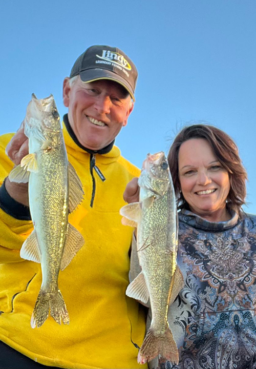 Image of The Hippie Chick and Jeff Sundin with nice walleye double