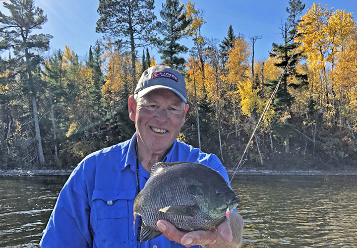 image of jeff sundin with big bluegill caught on exploration fishing trip