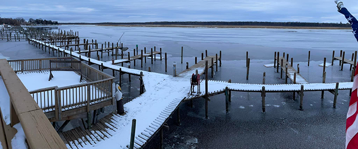 image of ice formed around the docks at River Bend Resort on the Rainy River