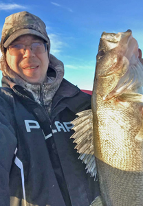 image of Captain Josh, Borderview Lodge with big walleye caught on lake of the woods