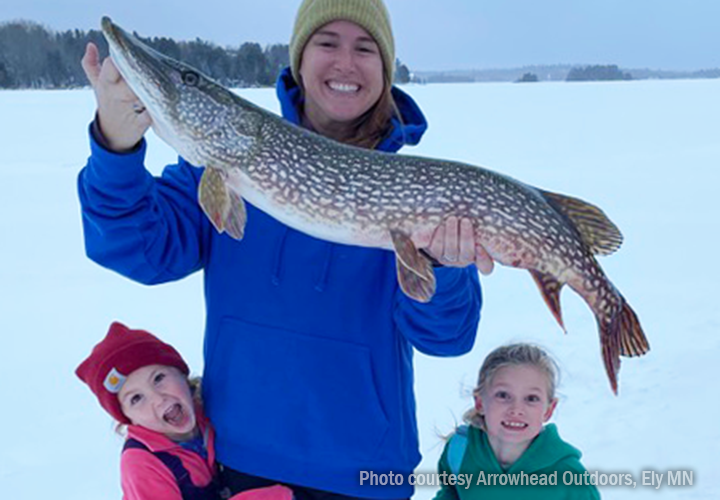 image of mother and daughters ice fishing for northern pike