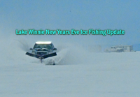 image of pickup truck plowing snow on Lake Winnie