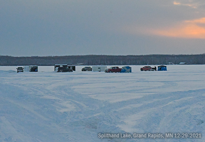 image of ice fishing shelters and pickup trucks on Splithand Lake December 29, 2021