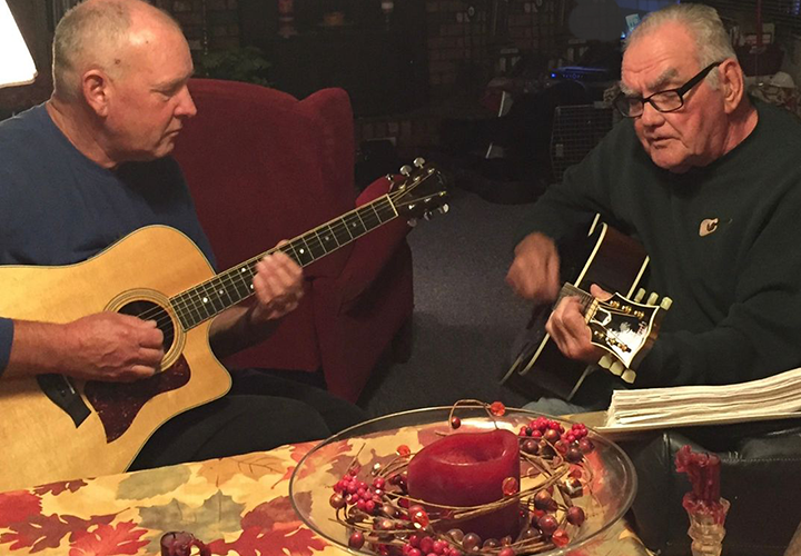 image of Bill Pelto and Jeff Sundin playing guitars circa 2015