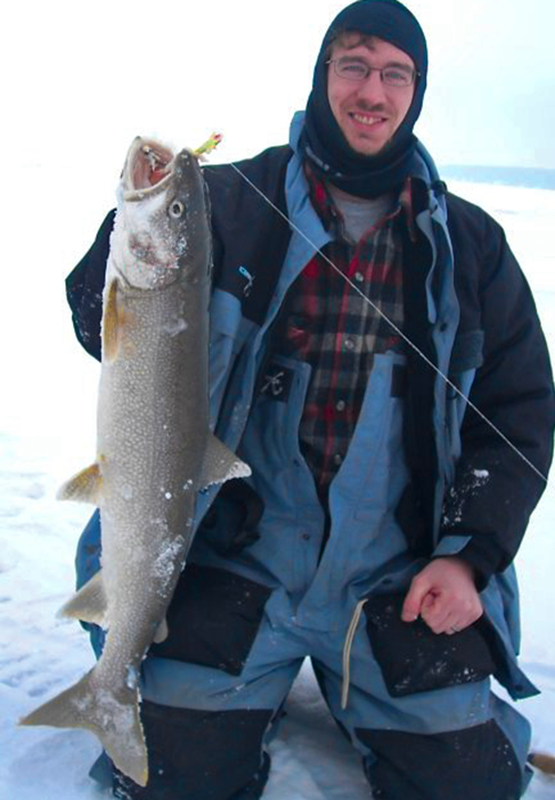 image of Matt Mattson with hefty Lake Trout caught in Northern Minnesota