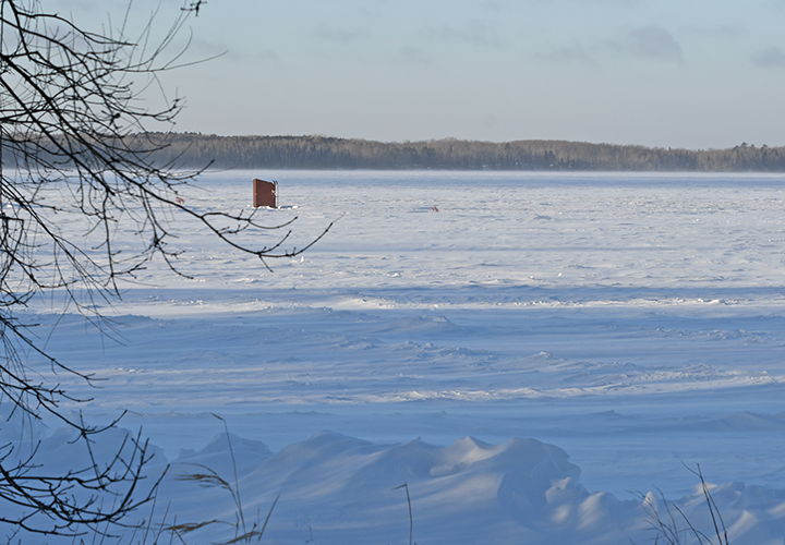 image of single spearing shack on the ice at Spring Lake