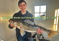 image of young man with huge walleye caught on Lake of the Woods while fishing at Border View Lodge