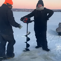 image links to video of Crystal Lillo drilling her first hole with an ice auger