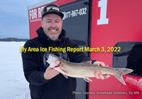 image of ice fisherman holding trout caught in the Ely MN Area