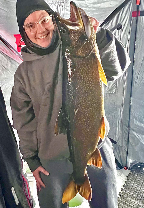 image of Joelle Bolos with big Lake Trout