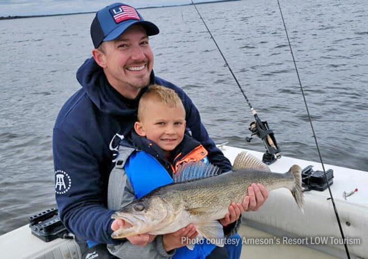 image of father and son with nice walleye caught on Lake of the Woods.