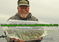 image of walleye angler holding an air bag filled with spottail shiners