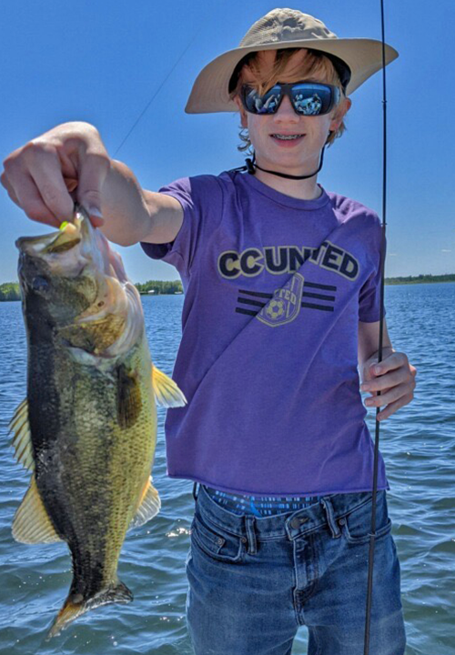 image of Finn Dunnigan holding a big largemouth bass